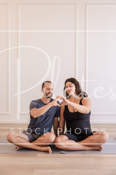 Couple on Mat Heart Hands (Vertical)